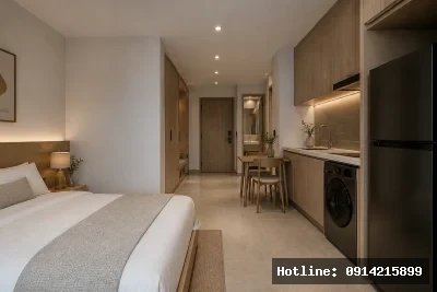 Nhìn từ cuối căn hộ | Từ khu ngủ có thể quan sát toàn bộ không gian sinh hoạt với bố cục rõ ràng và hệ lưu trữ tích hợp. Ánh sáng từ ban công phía trước giúp căn hộ luôn thông thoáng và dễ chịu.